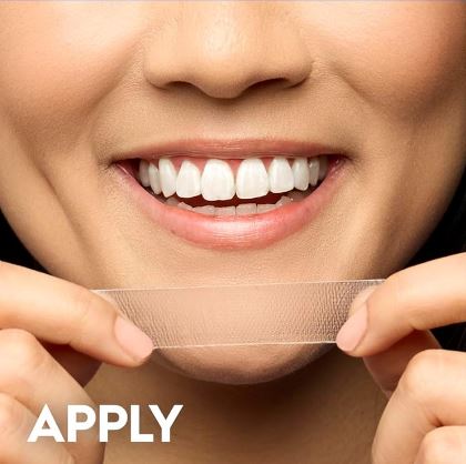 Apply the whitestrip to teeth